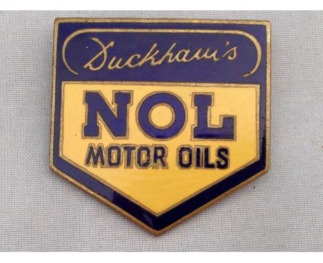 A Duckham's NOL Motor Oils yellow and blue enamel lapel badge.