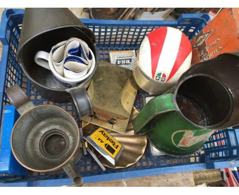 A crate of assorted oil measures including Castrol, an unusual BP copper measure, a Shell brass miniature clip board etc. 