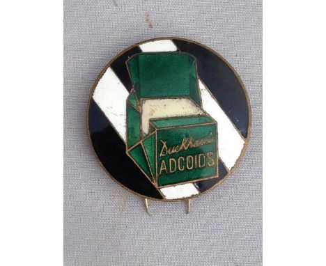 A Duckham's Adcoids circular enamel lapel badge.