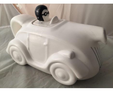A pottery teapot in the form of a motorcar marked to the base: Vandor 1978. 