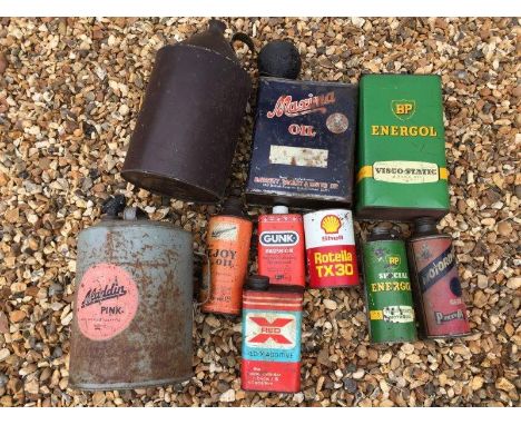 A box of assorted oil cans including Maxima Oil and BP etc.