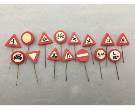 A collection of 15 road sign stick pins. 