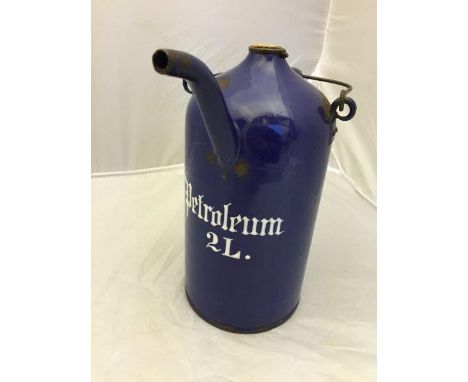 A dark blue enamel petroleum priming kettle. 