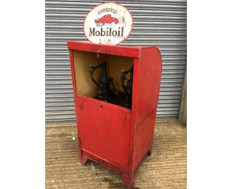 A large forecourt oil dispenser with oval Mobiloil double sided pediment enamel sign.