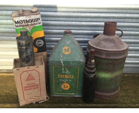 A selection of oil cans including a BP Energol five gallon pyramid can, a Castrol cylindrical fuel can, two Lockheed brake fl