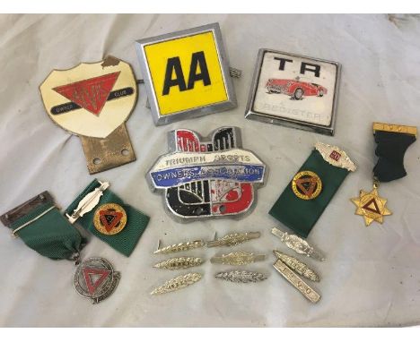 An Alvvis Owner's Club enamel badge, a TR Register badge and two others; also a small selection of Safe Driving Corporation p