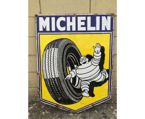 A Michelin enamel sign with image of Mr. Bibendum rolling a tyre, 24 x 32"