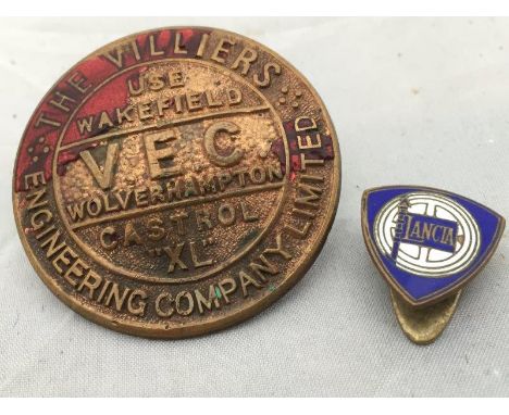 A Wakefield Castrol VEC Motor Oil badge clip together with a Lancia Motor Car enamel lapel badge. 