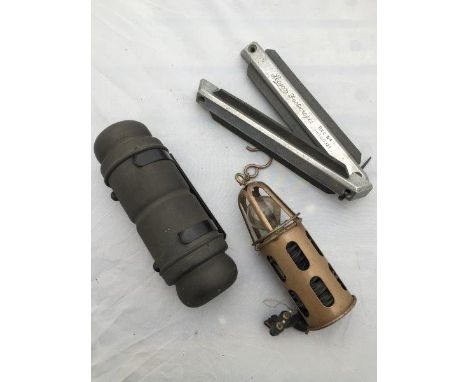 A Lucas no. 17c bulkhead mounted spare bulb holder complete with contents, a new old stock 12 volt inspection lamp and an unu
