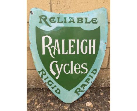 An early Raleigh Cycles shield shaped enamel sign in two tone green, with some retouching, 18 x 22".