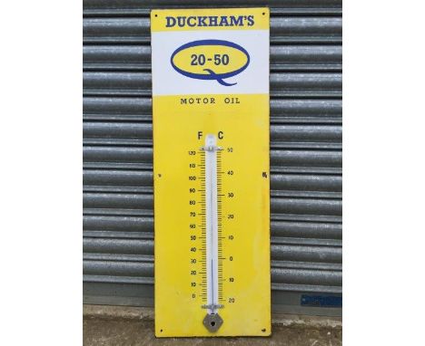 A Duckhams 20-50 Motor Oil enamel thermometer, 13 x 36"