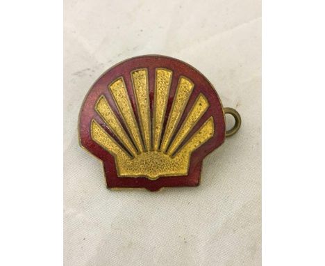 A small Shell part enamel cap badge. 