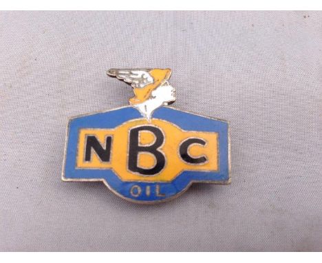 An NBC Oil blue and yellow enamel lapel badge.