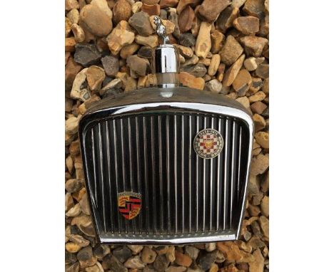 An unusual flask in the form of a radiator grille.