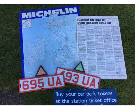 A small rectangular enamel sign - Buy your car park tokens at the station ticket office, a Michelin tin map sign, one other a