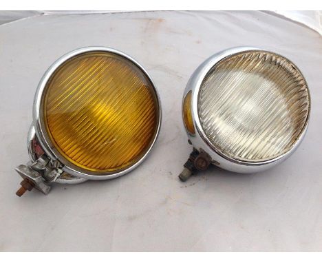 An amber fog lamp and a Hella spotlamp.