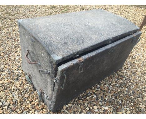 A large vintage car trunk. 