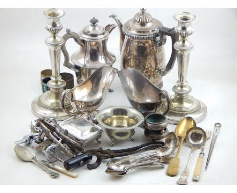 A 19th century Sheffield plate coffee pot with gadrooned rims, a pair of later silver plated candlesticks, a pair of late Vic