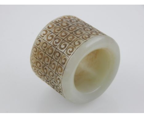 A Chinese jade archer's ring, decorated with a geometric pattern. 