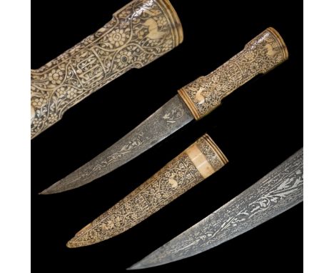 Rare Persian, Islam, dagger richly decorated with engravings, silver koftgari on the blade, 19th century. Double-edged curved