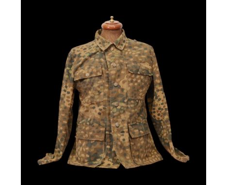 Rare WWII Nazi German SS "Dot 44" Camouflage Pattern Tunic (feldbluse). This historically significant piece was part of the s