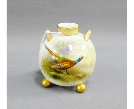 Royal Worcester small globular vase with twin handles and three gilt ball feet, hand painted with pheasant pattern and signed