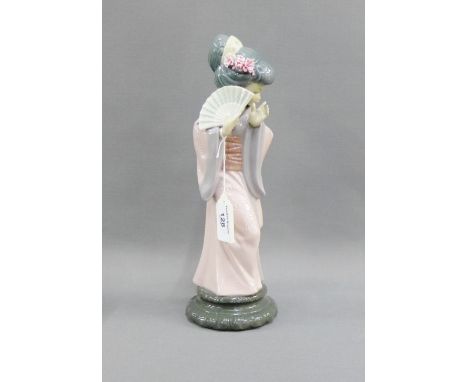 Lladro porcelain figure of a 'Japanese Girl with a Fan' on a circular base with printed backstamps, dated 1978, 30cm high