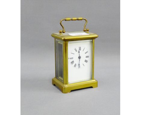 Brass carriage clock with Roman numerals and brass carry handle to top, height including handle 15cm