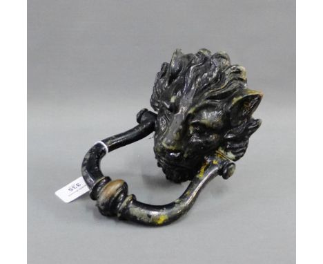 Black painted metal lion head door knocker