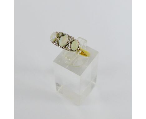 18 carat gold and platinum ring set with three opals and four bright cut diamonds, UK ring size R