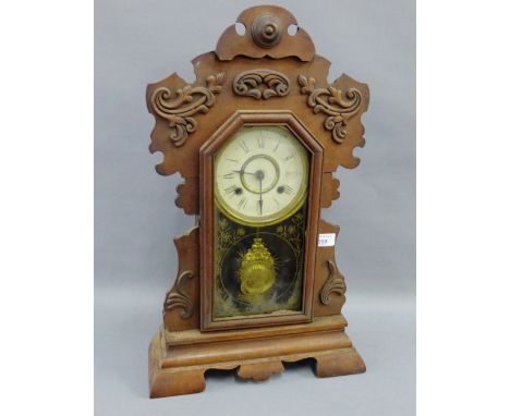 Gingerbread clock in a pine case with enamelled dial, Roman numerals and glass trunk door, 58cm high