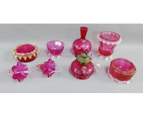 Collection of Cranberry glass to include a small oil lamp, vases, bowls, baskets etc., (8) 