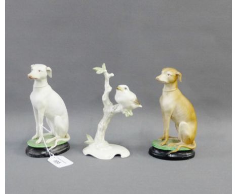 Hutschenreuther porcelain bird, modelled by K. Tutter, together with two bisque hound dog figures, tallest 17cm, (3) 
