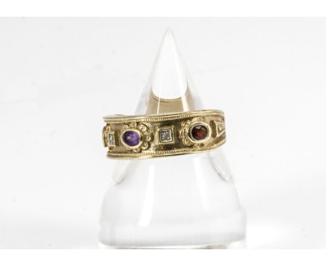 A 9ct gold Golden Jubilee Brooks &amp; Bentley gem set dress ring, set with garnets, diamonds, amethysts and sapphires, ring 