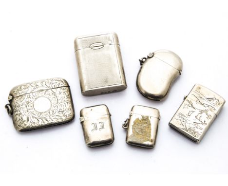 A group of four Victorian and later silver vesta cases, together with a silver match holder by Goldsmiths &amp; Silversmiths,