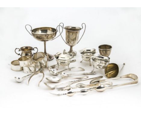 A collection of Victorian and 20th Century silver items, including three trophy cups, a pair of salts and mustard, wishbone s