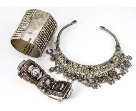 An early 20th Century continental white metal cuff bangle, of tapered form with bands of stylised cut beads marked Patricia, 