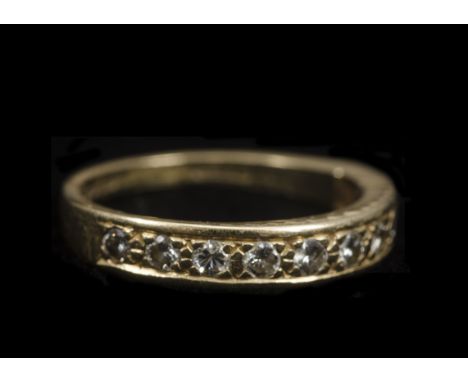 An 18ct gold half hoop diamond set eternity ring, the ten brilliant cuts in channel setting all in yellow gold, ring size M, 