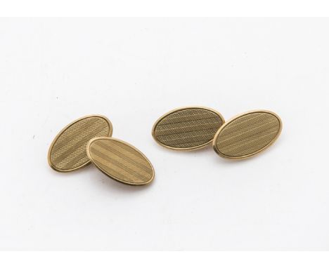 A pair of 1970s 9ct gold cufflinks, oval engine turned panels joined by chains, 5.6g, with a William H May card box (3) 