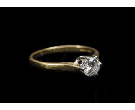 A diamond solitaire, the 18ct white gold claw setting on yellow  metal shank with brilliant cut diamond, estimated diamond we
