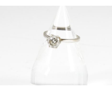 A diamond solitaire 14ct gold ring, the brilliant cut in six claw setting on a raised basket and white metal shank marked 585