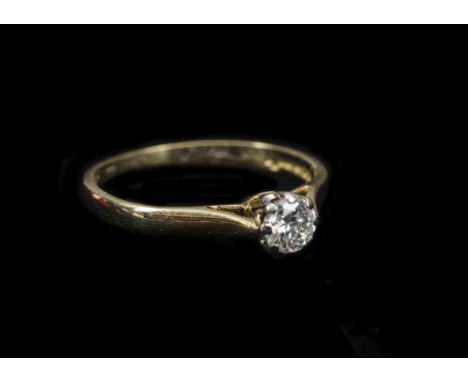 A diamond solitaire, in an 18ct gold white claw tipped mount on yellow gold shank, diamond approximately 0.25ct, ring size L 