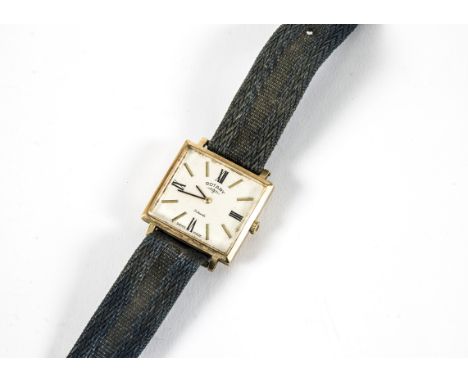 A 1960s Rotary 9ct gold cased gentleman's evening wristwatch, rectangular case 29mm wide, appears to run, on canvas strap 