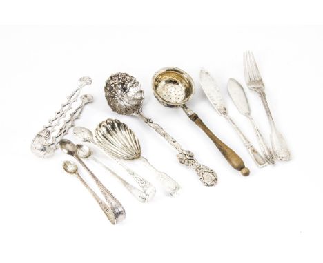 A group of nine Victorian silver serving items, including a tea caddy spoon by Walter &amp; John Barnard, a fancy strainer sp