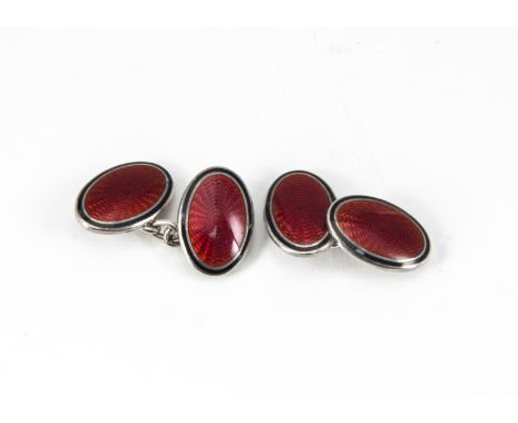 A pair of contemporary silver and enamel chain linked cufflinks, the oval panels with red engine turned guilloche enamel fron