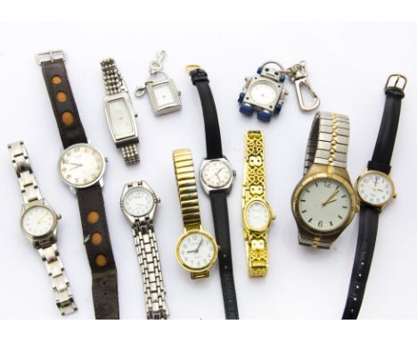 Eleven fashion watches and a mantle clock, the clear plastic and black Bakelite mantle clock marked Vega Made in USSR, togeth