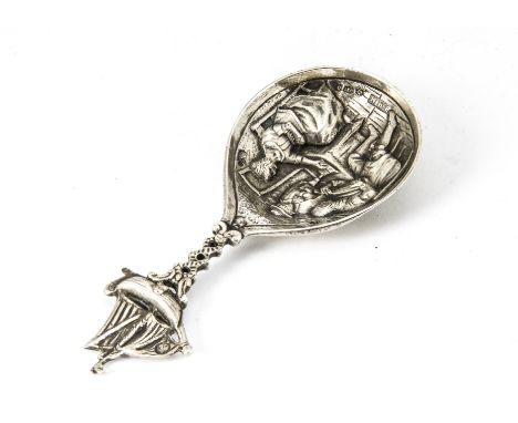 A Victorian silver tea caddy spoon from Berthold Hermann Muller, having sailing ship to finial and interior scene to well 