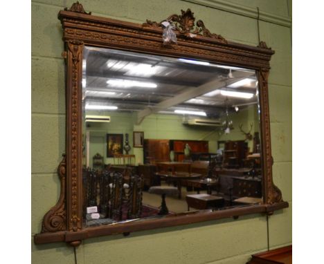 A gilt decorated over mantel mirror 