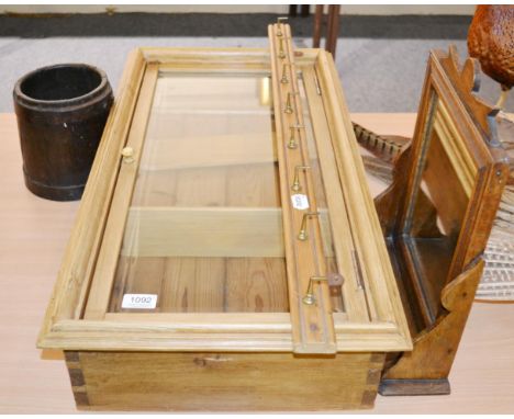 A small pine glazed cabinet, an oak mirror, a coat hook and an oak scoop (4)