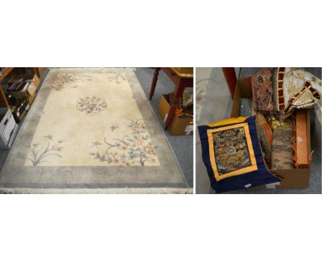 Modern carved Chinese carpet, the cream field with floral roundel enclosed by plain borders, 272cm by 180cm, together with as